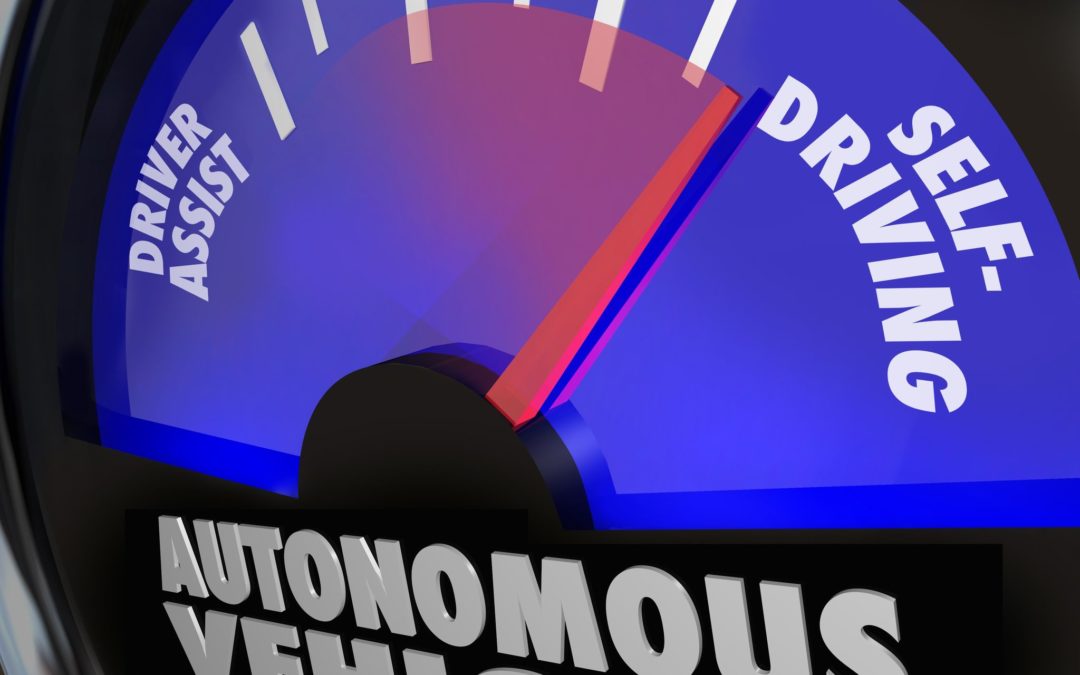 the words autonomous vehicles on an automobile gauge with the needle rising past driver assist to reach self-driving to illustrate the coming of new cars that drive themselves